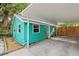 Quaint teal home with carport and tropical landscaping at 5107 27Th S Ave, Gulfport, FL 33707
