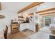 Well-equipped galley kitchen, white cabinets, and wooden shelving at 5107 27Th S Ave, Gulfport, FL 33707