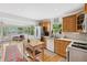 Kitchen boasts wood cabinets, stainless steel appliances, and an island with butcher block top at 5107 27Th S Ave, Gulfport, FL 33707