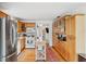 Open concept kitchen with wood cabinets, island, and stainless steel appliances at 5107 27Th S Ave, Gulfport, FL 33707