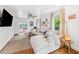Relaxing living room with neutral colored sectional sofa and terracotta tile floors at 5107 27Th S Ave, Gulfport, FL 33707