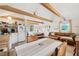 Open living space with leather couch, wood beams, and tiled floors at 5107 27Th S Ave, Gulfport, FL 33707