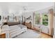 Spacious main bedroom with two beds, ample natural light, and hardwood floors at 5107 27Th S Ave, Gulfport, FL 33707