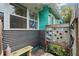 Unique outdoor shower with mosaic tile and corrugated metal siding at 5107 27Th S Ave, Gulfport, FL 33707