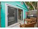 Small patio with wooden table and chairs, and a view into the bedroom at 5107 27Th S Ave, Gulfport, FL 33707
