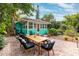 Relaxing patio with outdoor dining set and lush landscaping at 5107 27Th S Ave, Gulfport, FL 33707