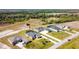Aerial view of a house with a pool and screened enclosure at 5226 Lake Venice Dr, Wimauma, FL 33598