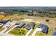 Aerial view of neighborhood with houses and open space at 5226 Lake Venice Dr, Wimauma, FL 33598