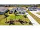 Aerial view of a house with a landscaped yard at 5226 Lake Venice Dr, Wimauma, FL 33598