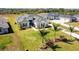 Aerial view of house and surrounding community at 5226 Lake Venice Dr, Wimauma, FL 33598