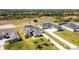 Aerial view of a house with a pool and screened enclosure at 5226 Lake Venice Dr, Wimauma, FL 33598