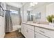 Bathroom with shower/tub combo, white vanity and gray tile at 5226 Lake Venice Dr, Wimauma, FL 33598