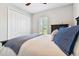 Bedroom with white built-ins and blue accents at 5226 Lake Venice Dr, Wimauma, FL 33598