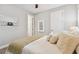 Bright bedroom with a comfortable bed and neutral decor at 5226 Lake Venice Dr, Wimauma, FL 33598