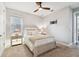 Light and airy bedroom featuring a queen bed and soft color palette at 5226 Lake Venice Dr, Wimauma, FL 33598
