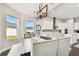 Casual dining area with farmhouse-style table and view into kitchen at 5226 Lake Venice Dr, Wimauma, FL 33598