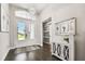 Bright and airy entryway with double doors and hardwood floors at 5226 Lake Venice Dr, Wimauma, FL 33598