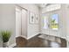 Bright and airy foyer with hardwood floors and double doors at 5226 Lake Venice Dr, Wimauma, FL 33598