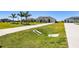 Attractive home with a long driveway and lush lawn at 5226 Lake Venice Dr, Wimauma, FL 33598
