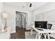 Bright home office features built-in shelving and hardwood floors at 5226 Lake Venice Dr, Wimauma, FL 33598