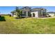 Two-story house with landscaping and driveway at 5226 Lake Venice Dr, Wimauma, FL 33598