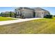 House exterior with driveway and landscaping at 5226 Lake Venice Dr, Wimauma, FL 33598