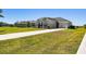 House exterior with driveway and landscaping at 5226 Lake Venice Dr, Wimauma, FL 33598