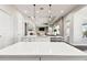 Open concept kitchen with island and breakfast bar seating area at 5226 Lake Venice Dr, Wimauma, FL 33598