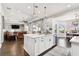 Open kitchen with large island, stainless appliances and Gathering room view at 5226 Lake Venice Dr, Wimauma, FL 33598
