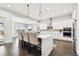 Eat-in kitchen with island seating and view into dining area at 5226 Lake Venice Dr, Wimauma, FL 33598
