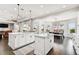 Bright kitchen with an island, breakfast nook, and views to backyard at 5226 Lake Venice Dr, Wimauma, FL 33598