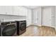 Bright laundry room with modern washer and dryer at 5226 Lake Venice Dr, Wimauma, FL 33598