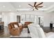 Relaxing living room featuring comfortable seating and hardwood floors at 5226 Lake Venice Dr, Wimauma, FL 33598