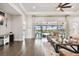 Relaxing living room with leather sofas and pool view at 5226 Lake Venice Dr, Wimauma, FL 33598