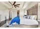 Bright and airy main bedroom with large bed and access to ensuite bathroom at 5226 Lake Venice Dr, Wimauma, FL 33598