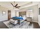 Spacious main bedroom with large bed, ceiling fan, and ample natural light at 5226 Lake Venice Dr, Wimauma, FL 33598