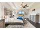 Main bedroom features a king-size bed, dresser, and large window with a view at 5226 Lake Venice Dr, Wimauma, FL 33598