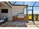 Modern outdoor kitchen with stainless steel appliances and wooden cabinetry at 5226 Lake Venice Dr, Wimauma, FL 33598