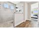 Large walk-in shower with glass enclosure and modern tile at 5226 Lake Venice Dr, Wimauma, FL 33598