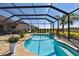 Inviting screened pool with a freeform design and ample surrounding space at 5226 Lake Venice Dr, Wimauma, FL 33598