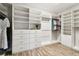 Large walk-in closet with custom built-in shelving at 5226 Lake Venice Dr, Wimauma, FL 33598