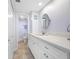 Bathroom with white vanity and quartz countertop at 5396 Gulf Blvd # 605, St Pete Beach, FL 33706