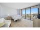 Bedroom with ocean view and sliding glass doors at 5396 Gulf Blvd # 605, St Pete Beach, FL 33706