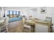 Bright dining area with table and chairs, view to living room at 5396 Gulf Blvd # 605, St Pete Beach, FL 33706