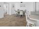 Dining area with kitchen access and modern decor at 5396 Gulf Blvd # 605, St Pete Beach, FL 33706