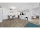 Bright dining area with kitchen access and modern table at 5396 Gulf Blvd # 605, St Pete Beach, FL 33706