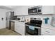 Modern kitchen featuring stainless steel appliances at 5396 Gulf Blvd # 605, St Pete Beach, FL 33706