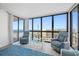Bright living room with ocean view and comfy seating at 5396 Gulf Blvd # 605, St Pete Beach, FL 33706