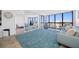 Living room with ocean view and comfortable seating at 5396 Gulf Blvd # 605, St Pete Beach, FL 33706
