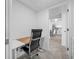Home office with desk and chair, view to hallway at 5396 Gulf Blvd # 605, St Pete Beach, FL 33706
